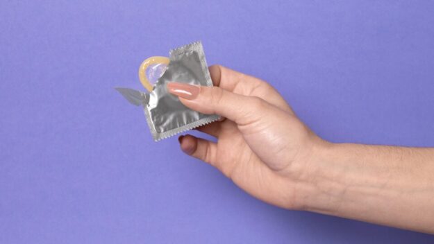 abstract-sexual-health-composition-with-condom-960×540